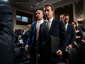 Mark Zuckerberg, chief executive officer of Meta Platforms Inc., centre, departs following a Senate Judiciary Committee hearing in Washington, D.C., on Wednesday, Jan. 31, 2024.