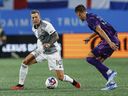 Toronto FC forward Federico Bernardeschi, left, battles Charlotte FC midfielder Andrew Privett for the ball in the first half of an MLS soccer match in Charlotte, N.C., Wednesday, Oct. 4, 2023. Italian star Federico Bernardeschi scored as Toronto FC tied Real Salt Lake 1-1 Wednesday in MLS pre-season play. THE CANADIAN PRESS/AP, Nell Redmond)