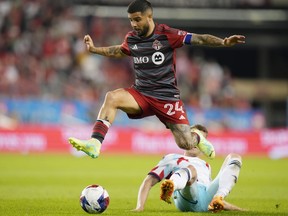 Toronto FC's Lorenzo Insigne skips over a challenge from Chicago Fire's Fabian Herbers during second half MLS action in Toronto on Wednesday, May 31, 2023. Insigne saw 62 minutes action in Toronto FC's season debut Sunday, a scoreless draw at FC Cincinnati. Less is more could be a TFC trend this season when it comes to the former Napoli captain as coach John Herdman and his staff look to keep the 32-year-old healthy for the season.THE CANADIAN PRESS/Chris Young