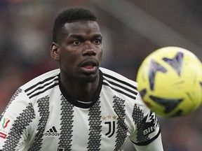 Juventus' Paul Pogba keeps his eyes on the ball during an Italian Cup match between Inter Milan and Juventus, at the San Siro Stadium, in Milan, April 26, 2023.