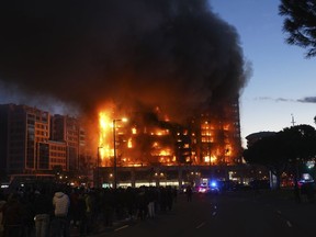 A housing block burns in Valencia, Spain, Thursday, Feb. 22, 2024. The cause of the fire is unknown and if there are any victims.