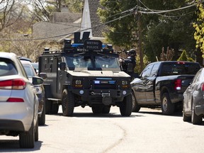 A SWAT team and other law enforcement arrive at a Nashville neighbourhood following a report of a school shooting on March 27.