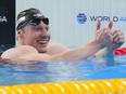 Finlay Knox of Canada celebrates after winning in the men's 200-metre medley final at the World Aquatics Championships in Doha, Qatar, Thursday, Feb. 15, 2024.