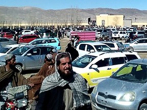This screen grab from a video taken on Jan. 22, 2024, shows Afghan men leaving a football stadium after attending the public execution by Taliban authorities of two men convicted of murder, in Ghazni.
