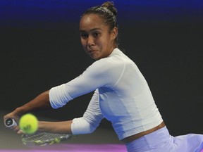Canada's Leylah Fernandez returns to Kazakstan's Elena Rybakina during the Qatar Open quarterfinal in Doha, Qatar, on Thursday, Feb. 15, 2024. Fernandez is out of the Dubai Tennis Championship after losing 6-3, 6-4 to Italy's Jasmine Paolini in the second round Tuesday.