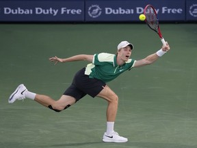 Denis Shapovalov of Canada returns the ball to Andy Murray of Great Britain during a match of the Dubai Duty Free Tennis Championships in Dubai, United Arab Emirates, Monday, Feb. 26, 2024.