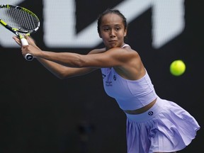 Leylah Fernandez of Canada plays a backhand return to Alycia Parks of the U.S. during their second round match at the Australian Open tennis championships at Melbourne Park, Melbourne, Australia, Wednesday, Jan. 17, 2024.