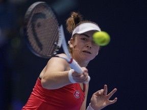 Canada's Marina Stakusic returns the ball against Italy's Martina Trevisan during their final singles tennis match at the Billie Jean King Cup finals at La Cartuja stadium in Seville, southern Spain, Sunday, Nov. 12, 2023.