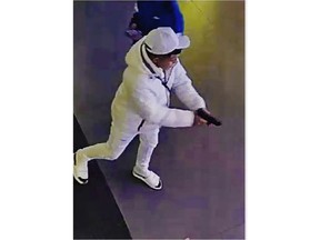 This surveillance image taken from a wanted poster provided by New York City Police Department Deputy Commissioner of Operations Kaz Daughtry on Friday, Feb. 9, 2024, shows a suspected shoplifter who shot a tourist in the leg inside a Times Square, New York, sporting goods store on Thursday, Feb. 8, 2024, who then fled into the street, stopping to shoot at a pursuing police officer.