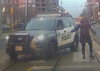 Rachel Wharton interacts with a Toronto Police officer in a screenshot from video.