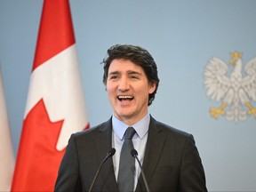 Prime minister Justin Trudeau reacts during a joint press conference with Poland's prime minister in Warsaw on Feb. 26, 2024.