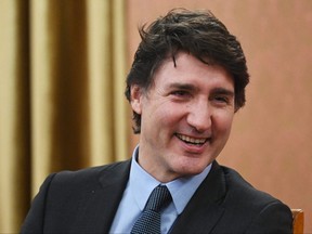 Prime Minister Justin Trudeau reacts prior to talks with Poland's prime minister in Warsaw, on Feb. 26, 2024.
