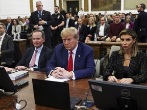 FILE - Former U.S. President Donald Trump, with lawyers Christopher Kise and Alina Habba, attends the closing arguments in the Trump Organization civil fraud trial at New York State Supreme Court in the Manhattan borough of New York, Thursday, Jan. 11, 2024. Within days, Trump could potentially have his sprawling real estate business empire ordered "dissolved" for repeated misrepresentations on financial statements to lenders, adding him to a short list of scam marketers, con artists and others who have been hit with the ultimate punishment for violating New York's powerful anti-fraud law.