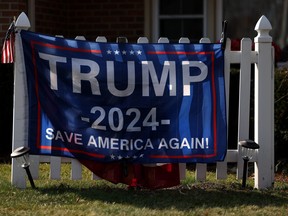A sign for Republican presidential candidate former president Donald Trump is displayed in a yard on primary election day on Feb. 27, 2024 in Dearborn, Michigan.