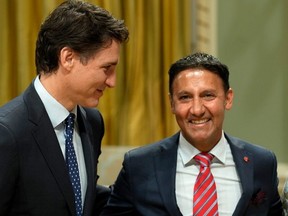 Minister of Justice and Attorney General of Canada Arif Virani poses for a photo with Prime Minister Justin Trudeau during a cabinet swearing-in ceremony at Rideau Hall in Ottawa, Wednesday, July 26, 2023. (The Canadian Press)