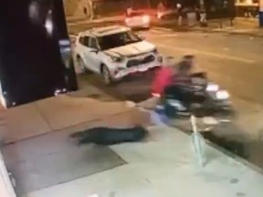 Screenshot of woman being dragged by two migrant criminals on moped in New York City.
