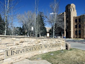 FILE - The University of Wyoming campus sign with the Wyoming Union in the background Friday March 23, 2012 in Laramie, Wyo. A single-vehicle wreck on a highway in northern Colorado killed three members of the University of Wyoming swimming and diving team. The crash happened Thursday, Feb. 23, 2024 on U.S. 287 about 10 miles (16 kilometers) south of the Wyoming-Colorado line between Laramie and Fort Collins, Colo.