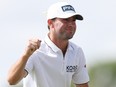 Austin Eckroat of the United States celebrates on the 18th green on his way to winning during the continuation of the weather delayed final round of The Cognizant Classic.