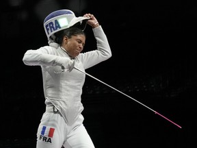 Ysaora Thibus of France celebrates defeating Arianna Errigo of Italy and won the women's individual Foil semifinal competition at the 2020 Summer Olympics.