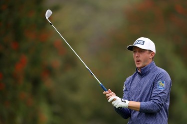 Mackenzie Hughes plays his shot from the fourth tee during the third round of The Genesis Invitational.