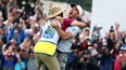 Nick Taylor celebrates with his caddie after making an eagle putt to win the RBC Canadian Open.