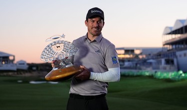 Nick Taylor poses with the trophy after winning the Phoenix Open earlier this year.