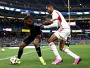 Andres Perea of New York City FC (left) and Tyrese Spicer of Toronto FC battle for the ball during the second half of an MLS game at Yankee Stadium on March 16, 2024.