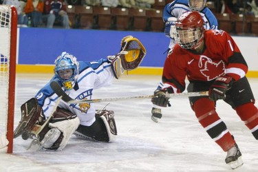 Goalkeeper Tuula Puputti of Finland makes a save against Canada during the Salt Lake City Winter Olympic Games.