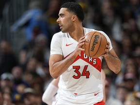 Toronto Raptors' Jontay Porter holds the ball during a game earlier this year.