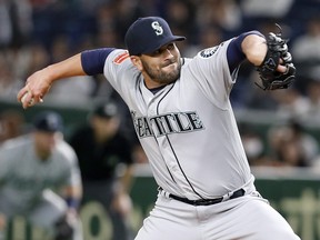 Seattle Mariners closer Chasen Bradford pitches against the Yomiuri Giants in 2019.