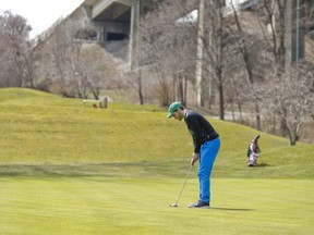 A golfer putts at the Don Valley golf course.