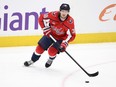 Washington Capitals defenceman Rasmus Sandin skates with the puck.