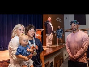 Tiger Woods (right) attended a ceremony for son Charlie with ex-wife Elin Nordegren.
