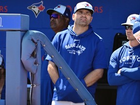 Joey Votto of the Toronto Blue Jays looks on from the dugout during spring training.