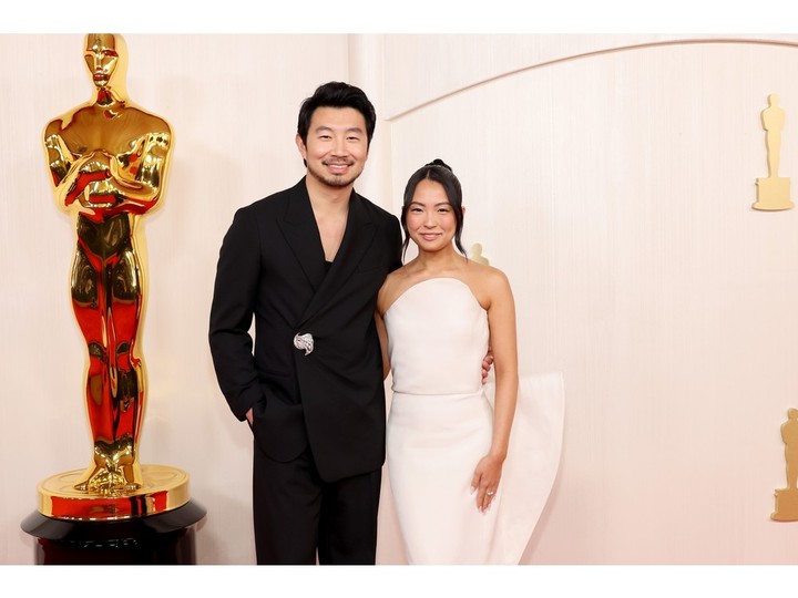 Simu Liu and Allison Hsu attend the 96th Annual Academy Awards on March 10, 2024 in Hollywood, California.