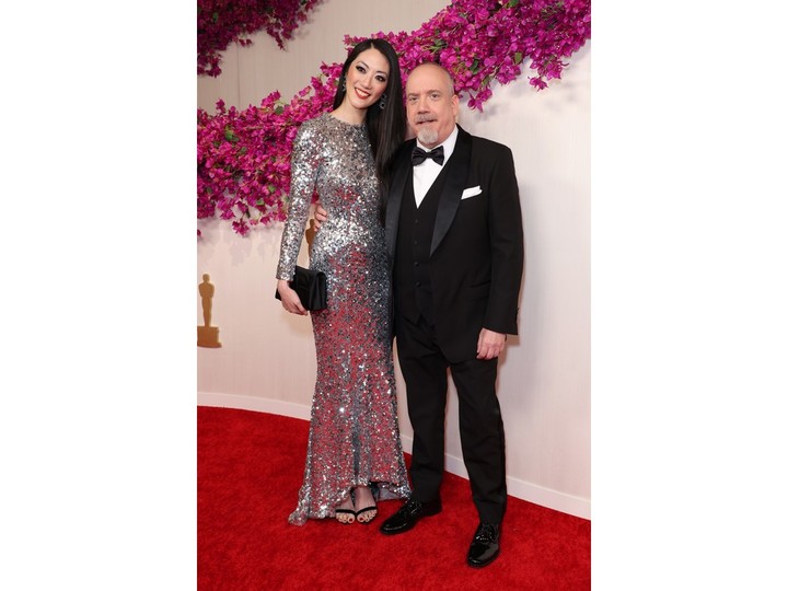 Clara Wong and Paul Giamatti attends the 96th Annual Academy Awards on March 10, 2024 in Hollywood, California.