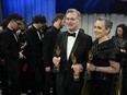 Christopher Nolan, winner of the awards for best director and best picture for "Oppenheimer," left, and Emma Thomas, winner of the award for best picture for "Oppenheimer" pose at the Governors Ball after the Oscars on Sunday, March 10, 2024, at the Dolby Theatre in Los Angeles.