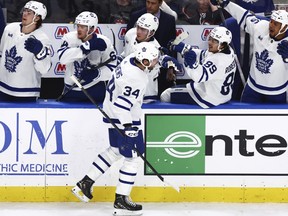Maple Leafs centre Auston Matthews (34) celebrates his 60th goal of the season during the third period against the Sabres in Buffalo, Saturday, March 30, 2024.