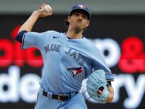 Toronto Blue Jays starting pitcher Kevin Gausman throws to a Minnesota Twins batter during the first inning in Game 1 of an AL wild-card baseball playoff series Tuesday, Oct. 3, 2023, in Minneapolis.