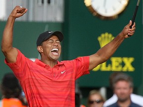 Tiger Woods of the United States celebrates after winning the British Open Golf Championship at the Royal Liverpool Golf Course in Hoylake, England Sunday July 23, 2006. (AP Photo/Jon Super)