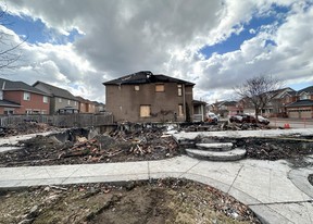 The charred remnants of a house at Van Kirk Dr. and Big Sky Rd., in Brampton, where a fire killed three members – Rajiv Warikoo, 51, his wife Shilpa Kotha, 47, and their daughter Mahek, 16 – is seen on Friday, March 15, 2024.