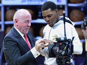 Toronto Raptors guard Kyle Lowry receives his 2019 NBA championship ring from Larry Tanenbaum, chairman of Maple Leaf Sports and Entertainment, before playing the New Orleans Pelicans in Toronto on Tuesday Oct. 22, 2019.
