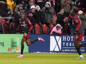 Toronto FC defender Tyrese Spicer (left) celebrates his goal against Atlanta United with teammate Aime Mabika. Arlyn McAdorey/The Canadian Press