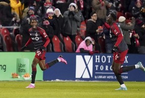 Toronto FC defender Tyrese Spicer (left) celebrates his goal against Atlanta United with teammate Aime Mabika. Arlyn McAdorey/The Canadian Press