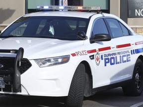 Police took a man into custody following the discovery of a woman's body in Ajax.