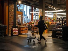 A shopper walks into a Farm Boy grocery store Toronto, Wednesday, Nov. 22, 2023.
