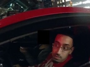 An image released by Toronto Police of a man sought in a dangerous driving probe from Nov. 3, 2023, on King St. at University Ave.