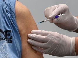 A man receives the Pfizer-BioNTech COVID-19 Vaccine at a vaccination center in Nuremberg, southern Germany, on March 18, 2021.