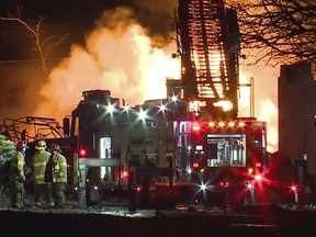 firefighters battle an industrial fire