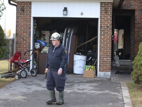 Ontario Fire Marshal investigator Jim Gillespie attends the scene of a double fatal fire at a townhome in Mississauga, Tuesday March 12, 2024.